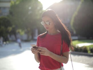 Girl with smartphone - solo travel