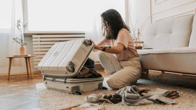 Girl packing suitcase