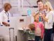Family checking in at airport
