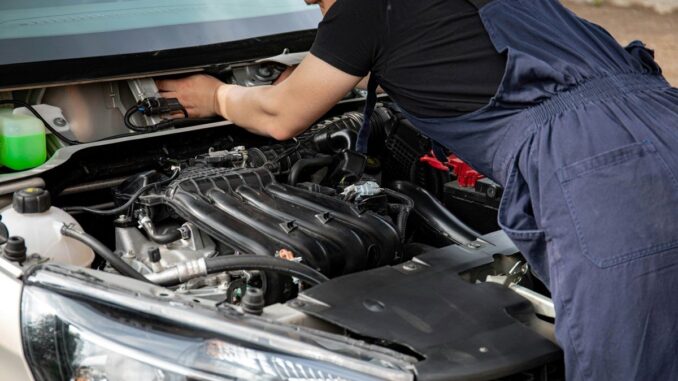 Mechanic working on car