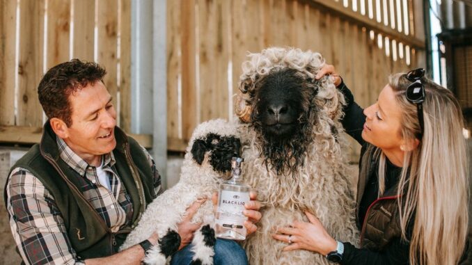 Tim and Tanya Spittle with bottle of BLACKLION Vodka