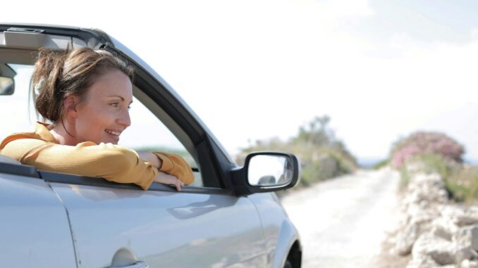 Girl in open top car