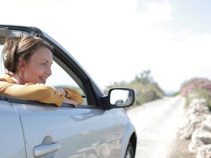 Girl in open top car