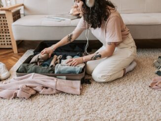 Girl packing clothes and gear