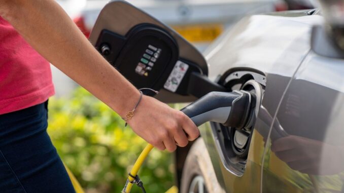 Plugging in EV charger