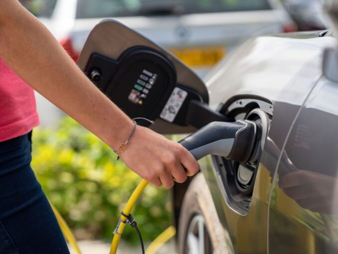 Plugging in EV charger