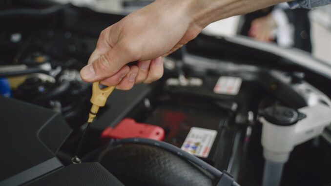 Checking engine oil diptstick