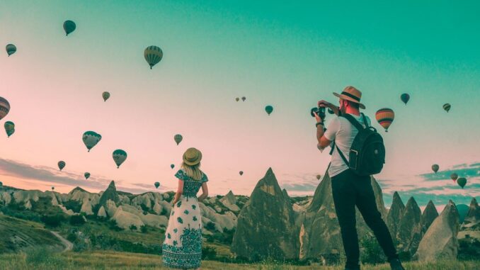 Couple watching balloons