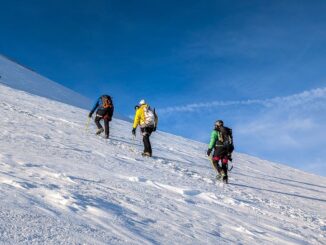 Mountaineers climbing in snow