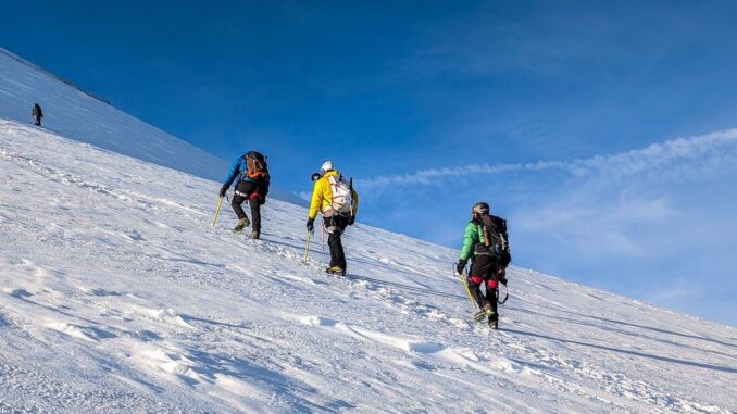 Mountaineers climbing in snow