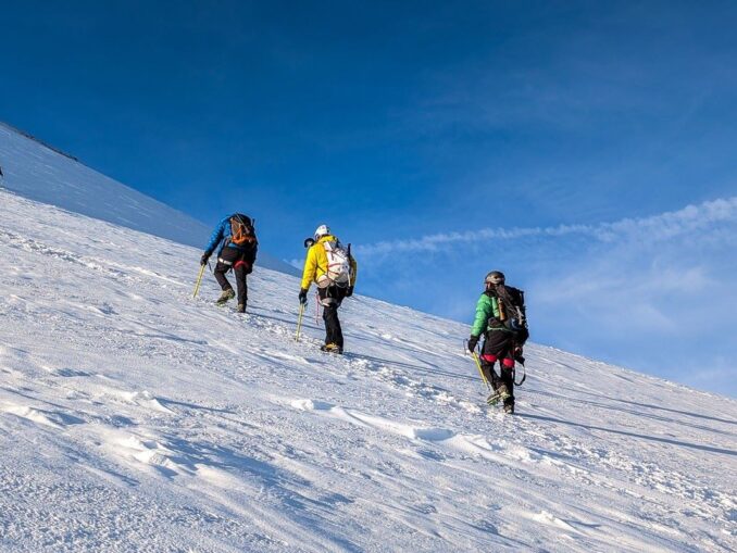 Mountaineers climbing in snow